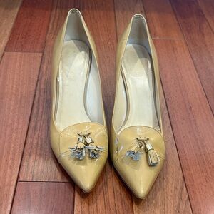 Kate Spade Classic Pointed-Toe Tassel Pumps in Nude/tan
